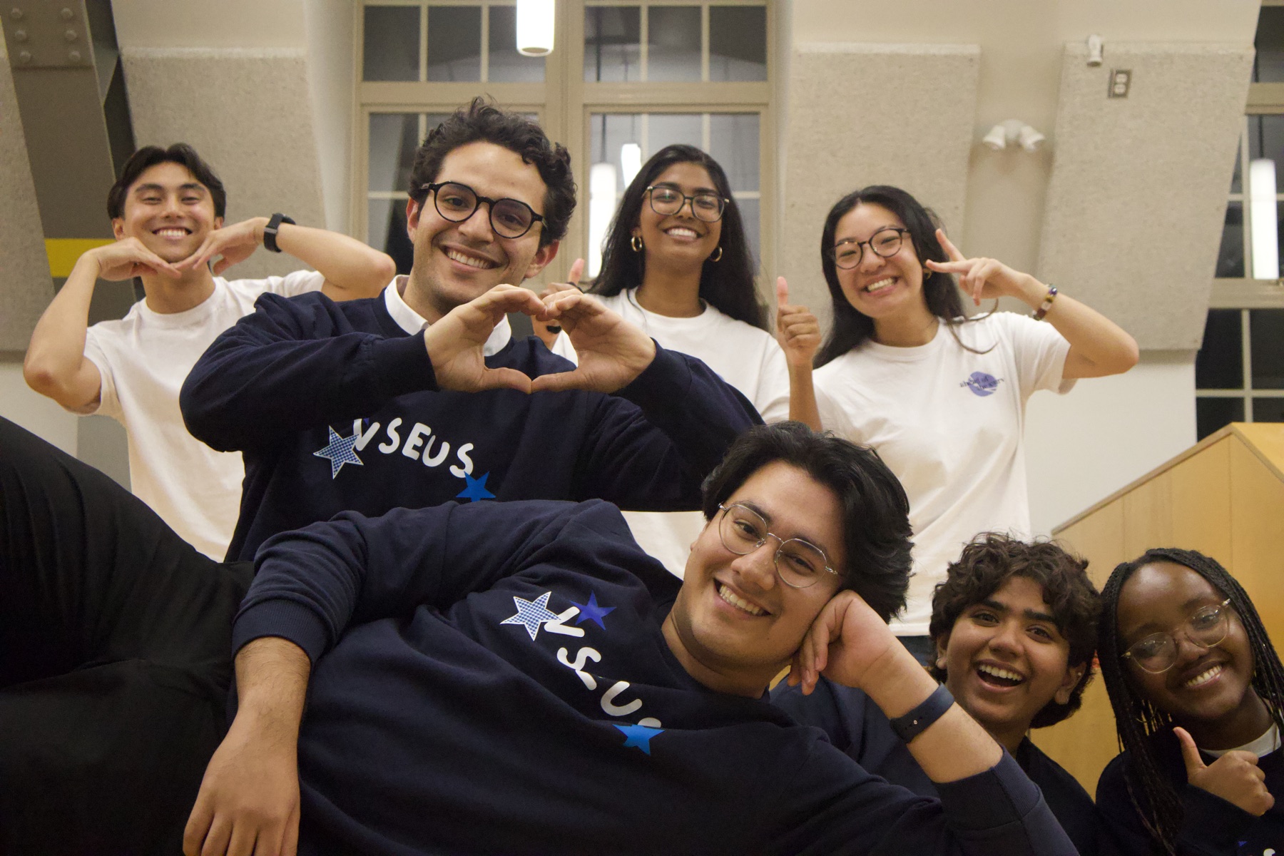 VSEUS members posing together in navy VSEUS crewnecks and white tees